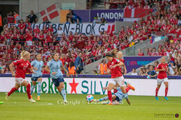Sofie Junge (# 13 Denmark) battles for the ball in the Women's Euro 2022 match Denmark vs Spain at Brentford Stadium, London, England