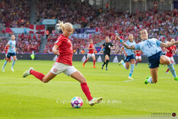 Pernille Harder (#10 Denmark) preparing for a shot in the Women's Euro 2022 match Denmark vs Spain at Brentford Stadium, London, England