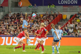 Karen Holmgaard (#6 Denmark) battles for the ball in the Women's Euro 2022 match Denmark vs Spain at Brentford Stadium, London, England