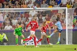 Action in front of Denmark's goal in the Women's Euro 2022 match Denmark vs Spain at Brentford Stadium, London, England