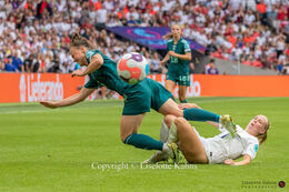 Marina Hegering (#5 Germany) is sent down by Beath Mead (#7 England) in the Women's Euro 2022 Final England vs Germany at Wembley Stadium, London, England