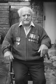 Herbert Fox wearing his & his father's medals