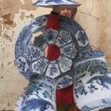 Stephanie Douet holding blue and white sculptures