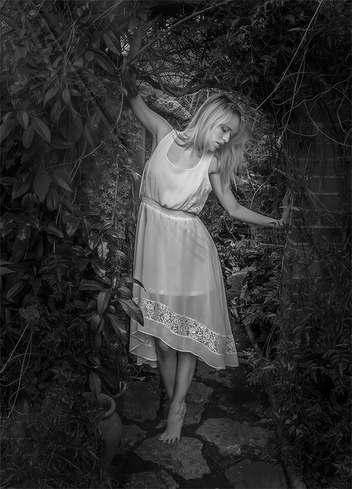 In Her Garden by Alan Lomakin