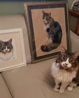 Angus alongside his portraits