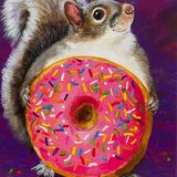 Funny squirrel with pink doughnut