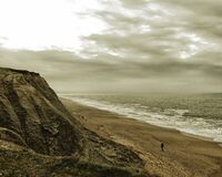 One man walks on an empty beach (1 of 1)