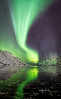 Aurora reflected in a fjord, Arctic Norway
