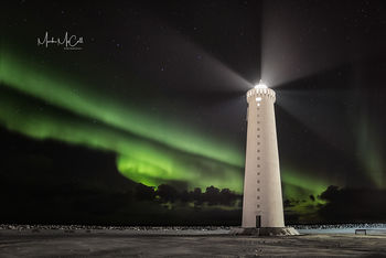 Lighthouse and aurora, Iceland