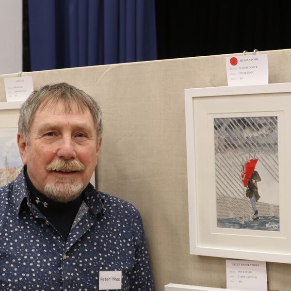 Peter with his painting ‘Media Storm’ which won first prize in the favourite painting completion in the November exhibition