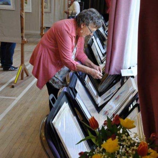 Checking the paintings in the portfolios