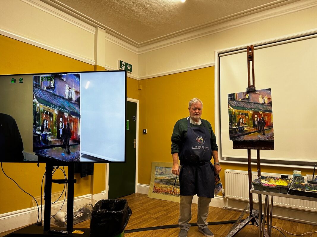 Peter Wood with final painting at demonstration