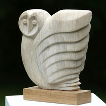Hand carved in Ancaster Limestone on an Oak plinth