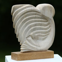 OWL Hand carved in Ancaster Limestone on an Oak plinth