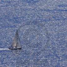 Lone Sailing Boat. Editorial.