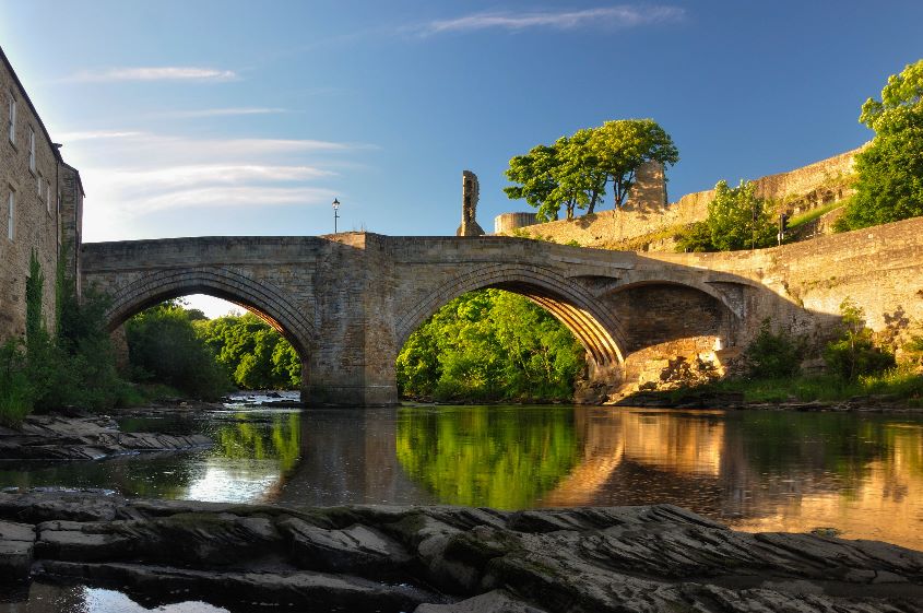 Water under castle bridge by James Mason