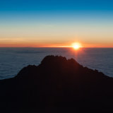 Sunrise across the African plains with Mawenzi in foreground