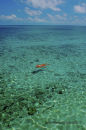 Girl floating off Sipadan Island