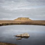 Rock pool and Fort Unst