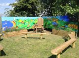 Outdoor Story mural and ceramic relief