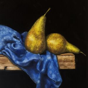 Two pears on a piece of blue cloth