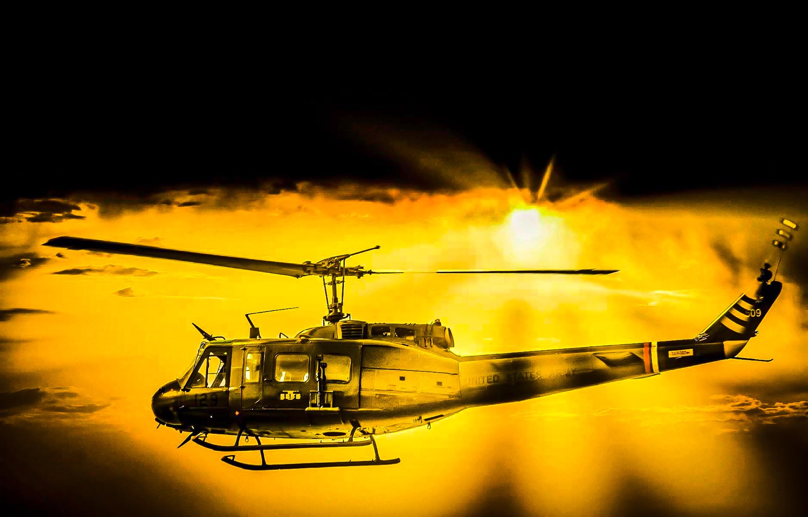 Huey Helicopter agains the orange glow and sun rays <a href= https://www.behance.net/cliffnorton ">latest Portfolio updates projects CliffNorton</a>
</body>
</html>