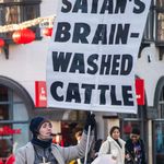 Power-full Statement about religion to the people of the city Leicester under blue sky and sunshine. Leicester February 12th 2020: A young man makes a power-full Statement about religion to the people of the city Leicester under blue sky and sunshine. Clifford Norton Alamy
