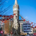 Power-full Statement about religion to the people of the city Leicester under blue sky and sunshine. Leicester February 12th 2020: A young man makes a power-full Statement about religion to the people of the city Leicester under blue sky and sunshine. Clifford Norton Alamy