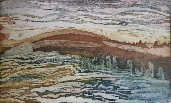 wavy clouds in the sky going from purple blacks with red to yellows through oranges.  Foreground looks like water with mountain and trees in the middle ground