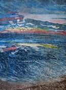Looking out to sea at twilight with blues, reds and yellows. Almost abstract.