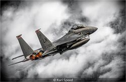 F15E Strike Eagle Punching Through The Cloud