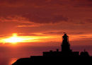 A FIERY SUNSET OVER STRUMBLE HEAD LIGHTHOUSE