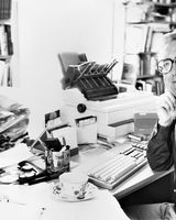 54 Crime Writer Len Deighton at his desk in Blackrock