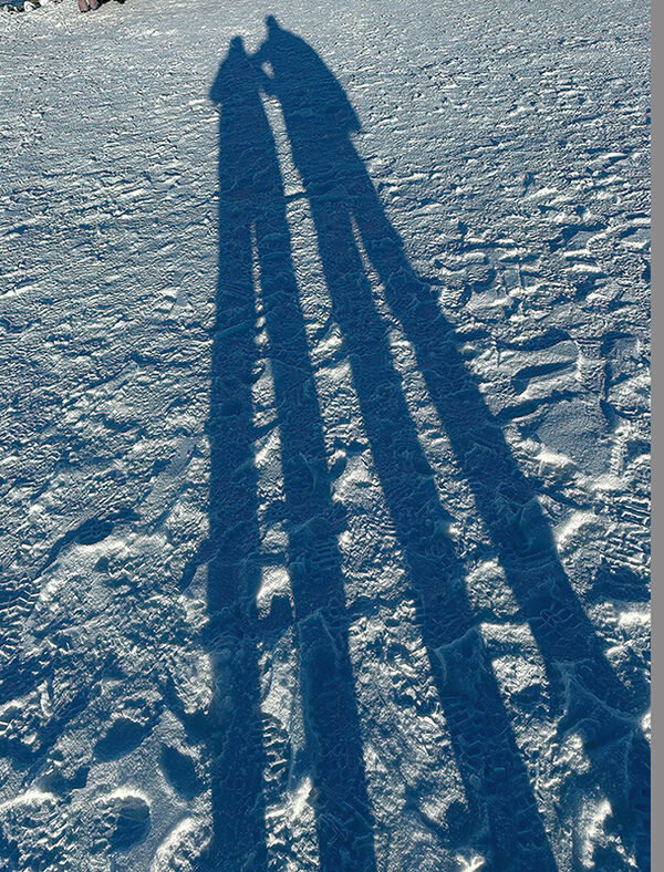Us standing on the Continent of Antarctica