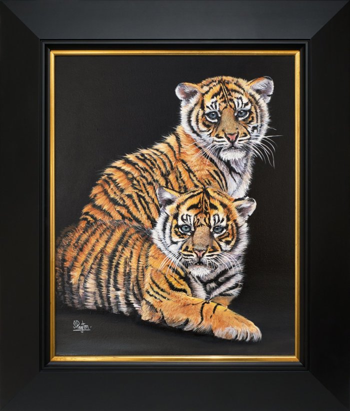 Two young tiger cubs.