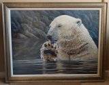 Paws for Thought. Polar bear in water licking his paw