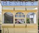 A barbers kiosk in the centre of the old town of Berat in central Albania. - 2009<BR><BR><BR><br><br><br><br>