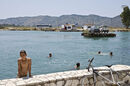 Kids swimming by the cable ferry across the Vivari channel at Butrint in Southern Albania. - 2009<br><br><br><br><br><br>