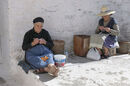 Knitting purses in the shade, in the Outer Mani Village of Kastania.<BR><BR><BR><br><br><br><br>
