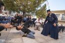 Boy and priest dancing at a Panayiri, a local festival celebrating name day, of the patron saint of the village church, Proastio, in the outer Mani, Southern Peloponnese, Greece.<br><br><br><br><br><br>