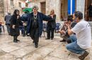 Woman dancing at a Panayiri, a local festival celebrating the name day of the patron saint of the village church, Proastio, Outer Mani, Southern Peloponnese, Greece.<br><br><br><br>