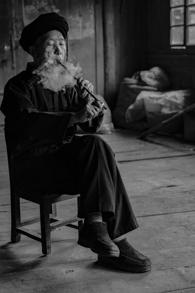 Mr Pan smokes his pipe