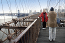 Two figures on Brooklyn Bridge