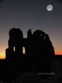 Ogmore castle and moon at sunset