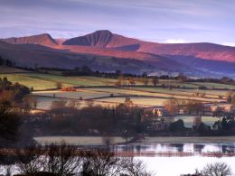 Dawn, Llangorse Lake and the Brecon Beacons.