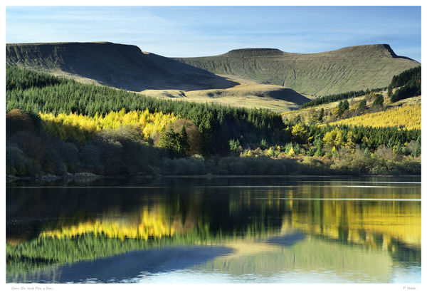 Corn Du and Pen y Fan reflection in Pentwyn Reservoir. Pentwyn Reservoir on a calm autumn afternoon with a reflection of the surrounding landscape that includes Corn Du and Pen y Fan mountains that are at the heart of the Brecon Beacons National Park.