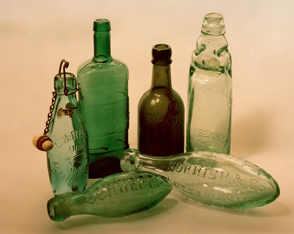 Derek Tostevin DPAGB, BPE1 Still Life Six Green Bottles