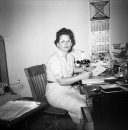 office worker with 1958 calendar.