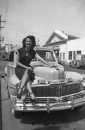 1950s shot of woman sat on a 1947 Mercury Town Sedan in California. Mercury_Town_Sedan