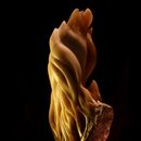 stone carving of golden flames